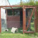 Shed with attached enclosure to give access to grass